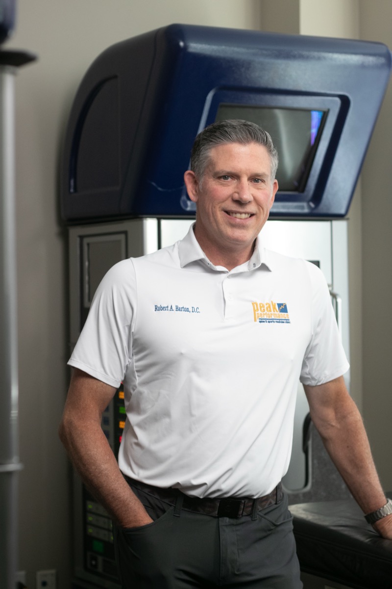 Dr. Robert Barton, DC at the DRX9000 decompression system